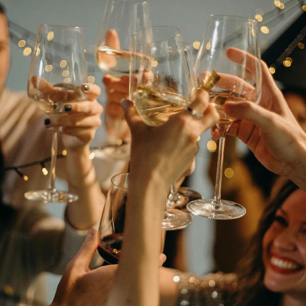 Colleagues cheering to Christmas with prosecco